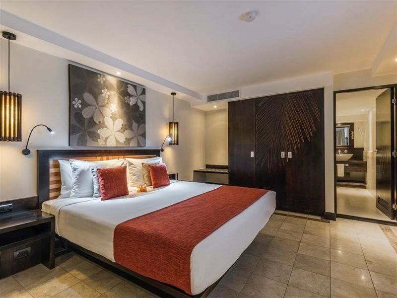 더 워릭 피지 코로레부 외부 사진 A bedroom at the Taj Bengal